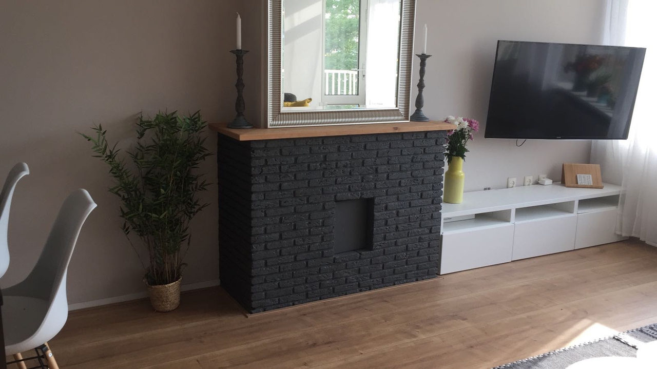 Black Brick Fireplace: rental property interior design in Amsterdam, photo 4 of 26