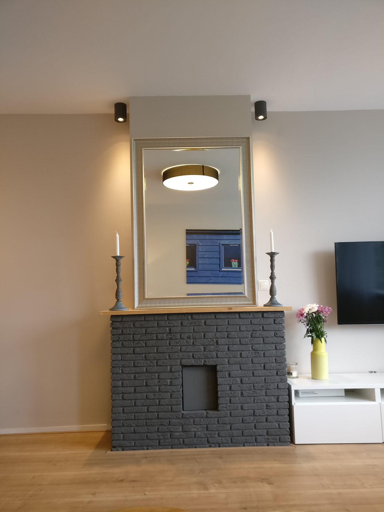 Black Brick Fireplace: rental property interior design in Amsterdam, photo 3 of 26