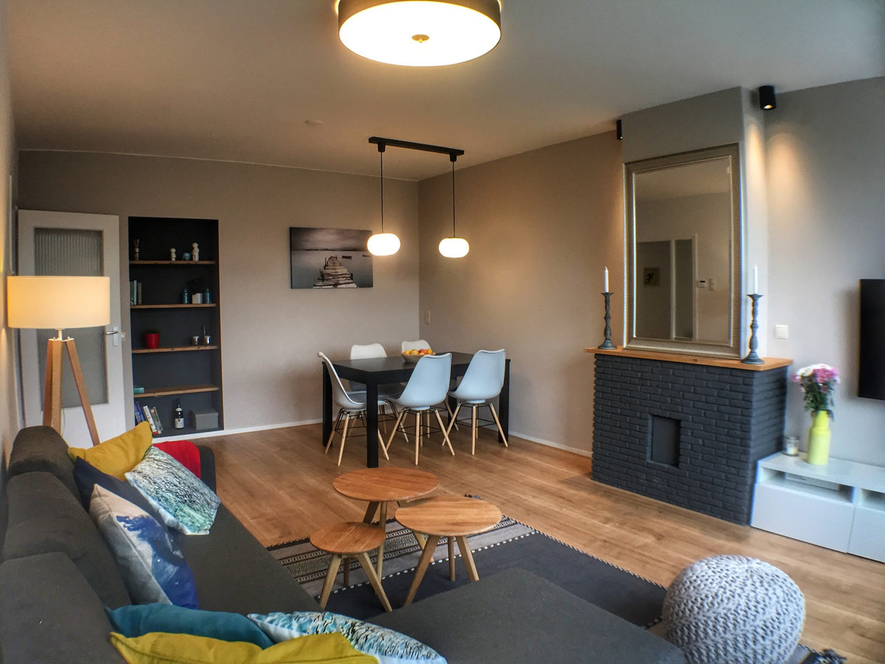 Black Brick Fireplace: rental property interior design in Amsterdam